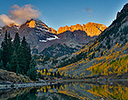 Sunrise Marron Bells autumn colors on aspens with pond reflection.