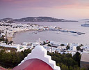 Chapel and overview of harbor sunset Hora, Mykonos Greek Isles.