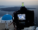 Evening light and bell town and blue church dome, Santorini Greek Isles