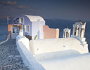 Evening light and colorul buildings Oia, Santorini Greek Isles